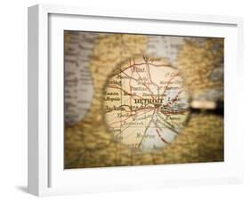 Magnifying Glass In Front Of A Detroit Map-gemenacom-Framed Art Print