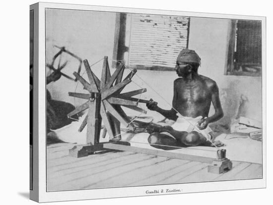 Mahatma Gandhi Indian Nationalist and Spiritual Leader Spins at a Wheel in 1931-null-Stretched Canvas