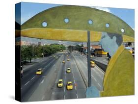 Main Avenue is Empty of Private Cars, Seen from a Bridge Decorated with a Statue of a Pedestrian-null-Stretched Canvas