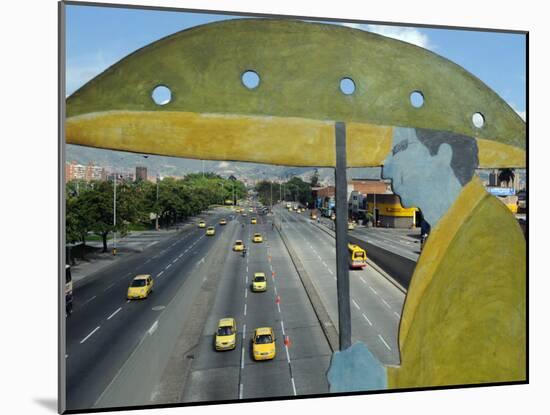 Main Avenue is Empty of Private Cars, Seen from a Bridge Decorated with a Statue of a Pedestrian-null-Mounted Photographic Print