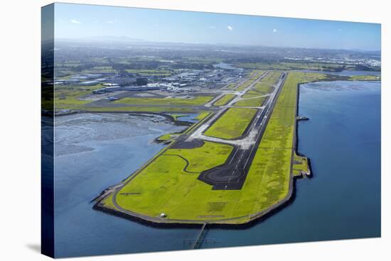 Main Runway at Auckland Airport, and Manukau Harbour, Auckland, North Island, New Zealand-David Wall-Stretched Canvas