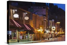 Main Street at Dusk, Deadwood, South Dakota, USA-Walter Bibikow-Stretched Canvas