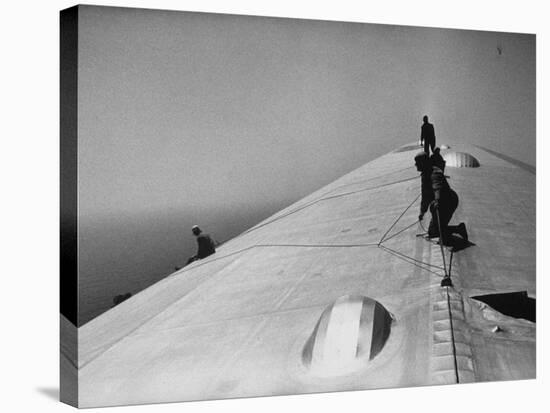 Maintenance Crewmen on Top of Graf Zeppelin repair damage caused Atlantic Ocean Storm during flight-Alfred Eisenstaedt-Stretched Canvas