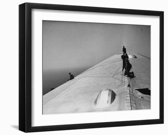 Maintenance Crewmen on Top of Graf Zeppelin repair damage caused Atlantic Ocean Storm during flight-Alfred Eisenstaedt-Framed Premium Photographic Print