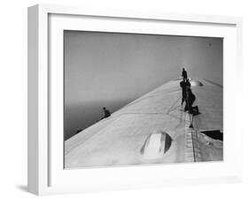 Maintenance Crewmen on Top of Graf Zeppelin repair damage caused Atlantic Ocean Storm during flight-Alfred Eisenstaedt-Framed Photographic Print