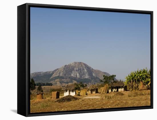 Malawi, Dedza, Grass-Roofed Houses in a Rural Village in the Dedza Region-John Warburton-lee-Framed Stretched Canvas