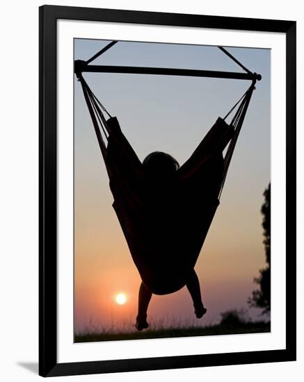 Malawi, Lake Malawi National Park, Young Guest Relaxes in a Hammock at Pumulani Lodge, (MR)-John Warburton-lee-Framed Photographic Print