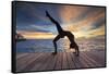 Maldives, South Ari Atoll, Thudufushi Island, Diamonds Thudufushi Resort, woman practising Yoga at -Michele Falzone-Framed Stretched Canvas