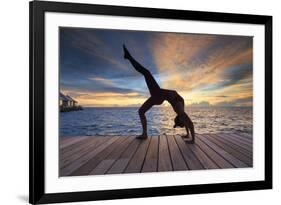 Maldives, South Ari Atoll, Thudufushi Island, Diamonds Thudufushi Resort, woman practising Yoga at -Michele Falzone-Framed Photographic Print