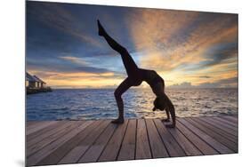 Maldives, South Ari Atoll, Thudufushi Island, Diamonds Thudufushi Resort, woman practising Yoga at -Michele Falzone-Mounted Photographic Print