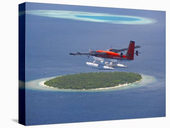 Maldivian Air Taxi Flying Above Island, Maldives, Indian Ocean, Asia-Sakis Papadopoulos-Stretched Canvas