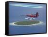 Maldivian Air Taxi Flying Above Island, Maldives, Indian Ocean, Asia-Sakis Papadopoulos-Framed Stretched Canvas