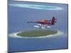 Maldivian Air Taxi Flying Above Island, Maldives, Indian Ocean, Asia-Sakis Papadopoulos-Mounted Photographic Print