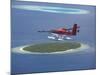 Maldivian Air Taxi Flying Above Island, Maldives, Indian Ocean, Asia-Sakis Papadopoulos-Mounted Photographic Print