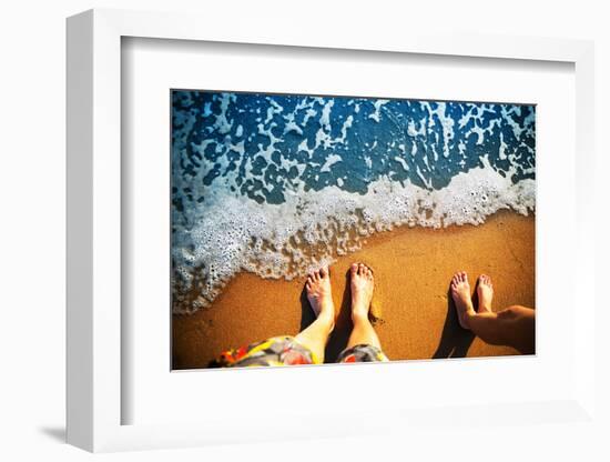 Male and Female Feet are Standing on the Sandy Beach-Nomad Soul-Framed Photographic Print