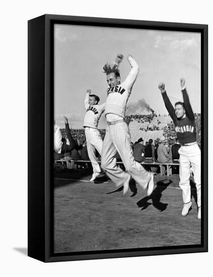 Male Cheerleaders in Action at Wisconsin-Marquette Football Game-Alfred Eisenstaedt-Framed Stretched Canvas