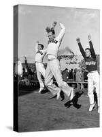 Male Cheerleaders in Action at Wisconsin-Marquette Football Game-Alfred Eisenstaedt-Stretched Canvas