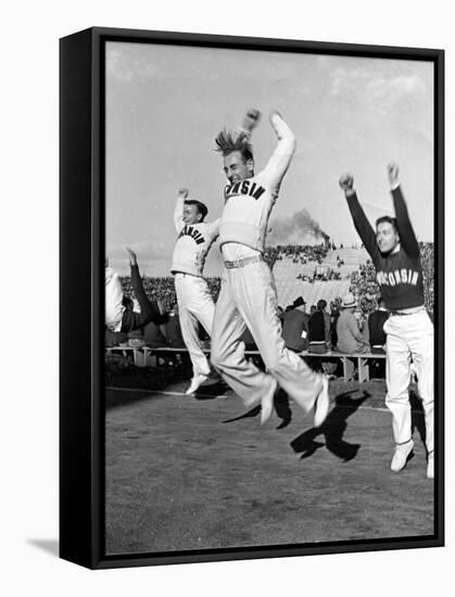 Male Cheerleaders in Action at Wisconsin-Marquette Football Game-Alfred Eisenstaedt-Framed Stretched Canvas