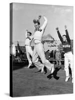 Male Cheerleaders in Action at Wisconsin-Marquette Football Game-Alfred Eisenstaedt-Stretched Canvas