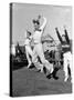 Male Cheerleaders in Action at Wisconsin-Marquette Football Game-Alfred Eisenstaedt-Stretched Canvas