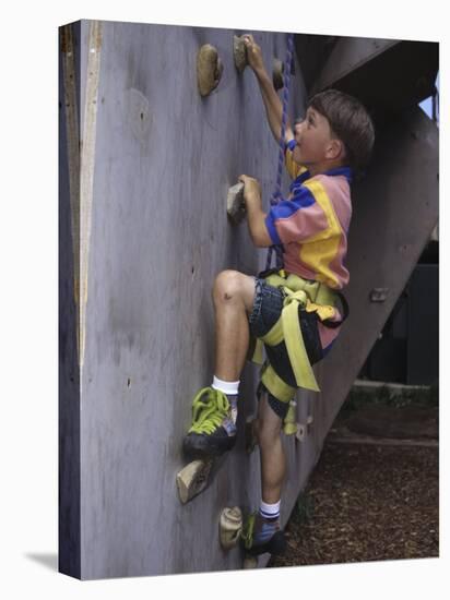 Male Child Wall Climbing Indoors-null-Stretched Canvas