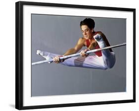 Male Gymnast Performing on the Horizontal Bar-null-Framed Photographic Print
