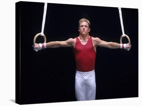 Male Gymnast Performing on the Rings-null-Stretched Canvas