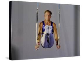 Male Gymnast Performing on the Rings-null-Stretched Canvas