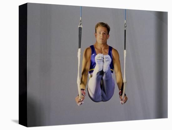 Male Gymnast Performing on the Rings-null-Stretched Canvas