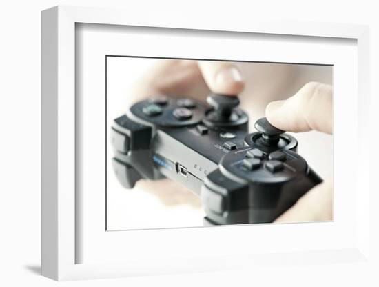 Male Hands Holding Video Game Controller Closeup-elenathewise-Framed Photographic Print