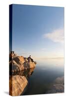 Male Hiker Resting Along The Shore Of The Great Salt Lake From Antelope Island State Park In Utah-Austin Cronnelly-Stretched Canvas