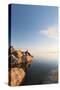 Male Hiker Resting Along The Shore Of The Great Salt Lake From Antelope Island State Park In Utah-Austin Cronnelly-Stretched Canvas