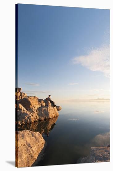 Male Hiker Resting Along The Shore Of The Great Salt Lake From Antelope Island State Park In Utah-Austin Cronnelly-Stretched Canvas