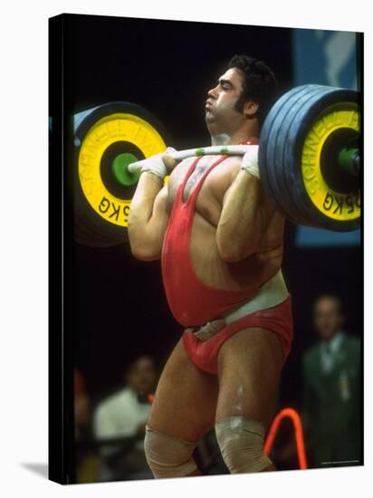 Male Lifting Heavy Weights in Competition at the Olympics-John Dominis-Stretched Canvas