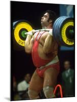 Male Lifting Heavy Weights in Competition at the Olympics-John Dominis-Mounted Premium Photographic Print