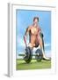 Male Musculature Looking at a Dumbbell on the Grass-null-Framed Art Print