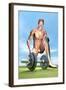 Male Musculature Looking at a Dumbbell on the Grass-null-Framed Art Print