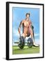 Male Musculature Looking at a Dumbbell on the Grass-null-Framed Art Print