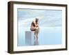 Male Musculature Sitting on a Cube, Thinking under a Rainbow-null-Framed Art Print