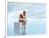 Male Musculature Sitting on a Cube, Thinking under a Rainbow-null-Framed Art Print