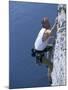Male Rock Climber Reaching for a Grip-null-Mounted Photographic Print