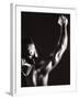 Male Runner Holding Up a Relay Baton-null-Framed Photographic Print