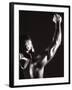 Male Runner Holding Up a Relay Baton-null-Framed Photographic Print