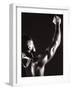 Male Runner Holding Up a Relay Baton-null-Framed Photographic Print