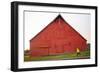 Male Runner Runs Along A Gravel Trail In Front Of Bright Red Barn In UI Arboretum In Moscow, Idaho-Ben Herndon-Framed Photographic Print