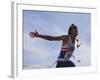 Male Runner Victorious at the Finish Line in a Track Race-null-Framed Photographic Print