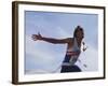 Male Runner Victorious at the Finish Line in a Track Race-null-Framed Photographic Print