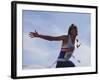 Male Runner Victorious at the Finish Line in a Track Race-null-Framed Photographic Print