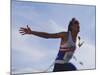Male Runner Victorious at the Finish Line in a Track Race-null-Mounted Photographic Print