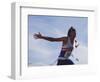 Male Runner Victorious at the Finish Line in a Track Race-null-Framed Photographic Print